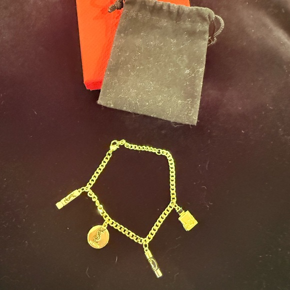 Elegant Gold Charm Bracelet with Iconic Accents - Picture 2 of 6